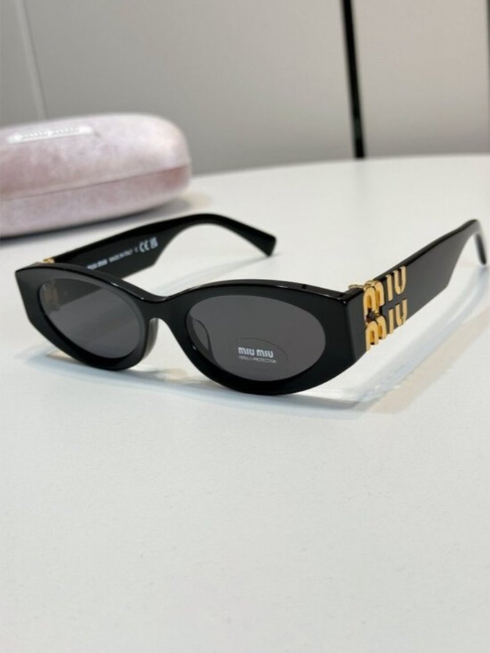 Miu Miu Black Frame Black Lens Oval Sunglasses